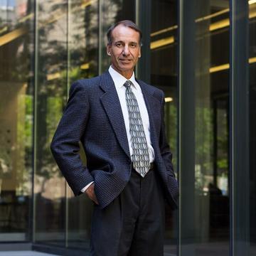 Portrait photo of David Scrymgeour standing in front of a building